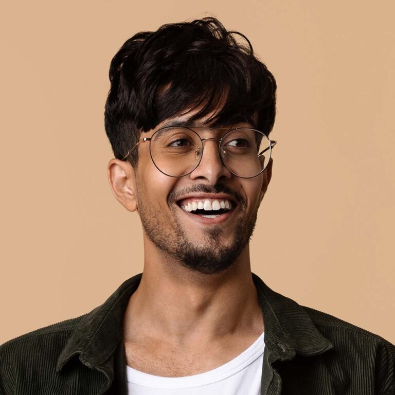 cheerful-middle-eastern-guy-using-tablet-looking-N5S44P2